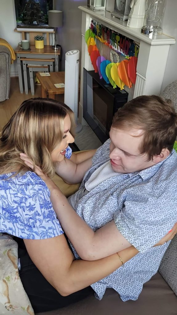 Becky and Nathan share a cuddle